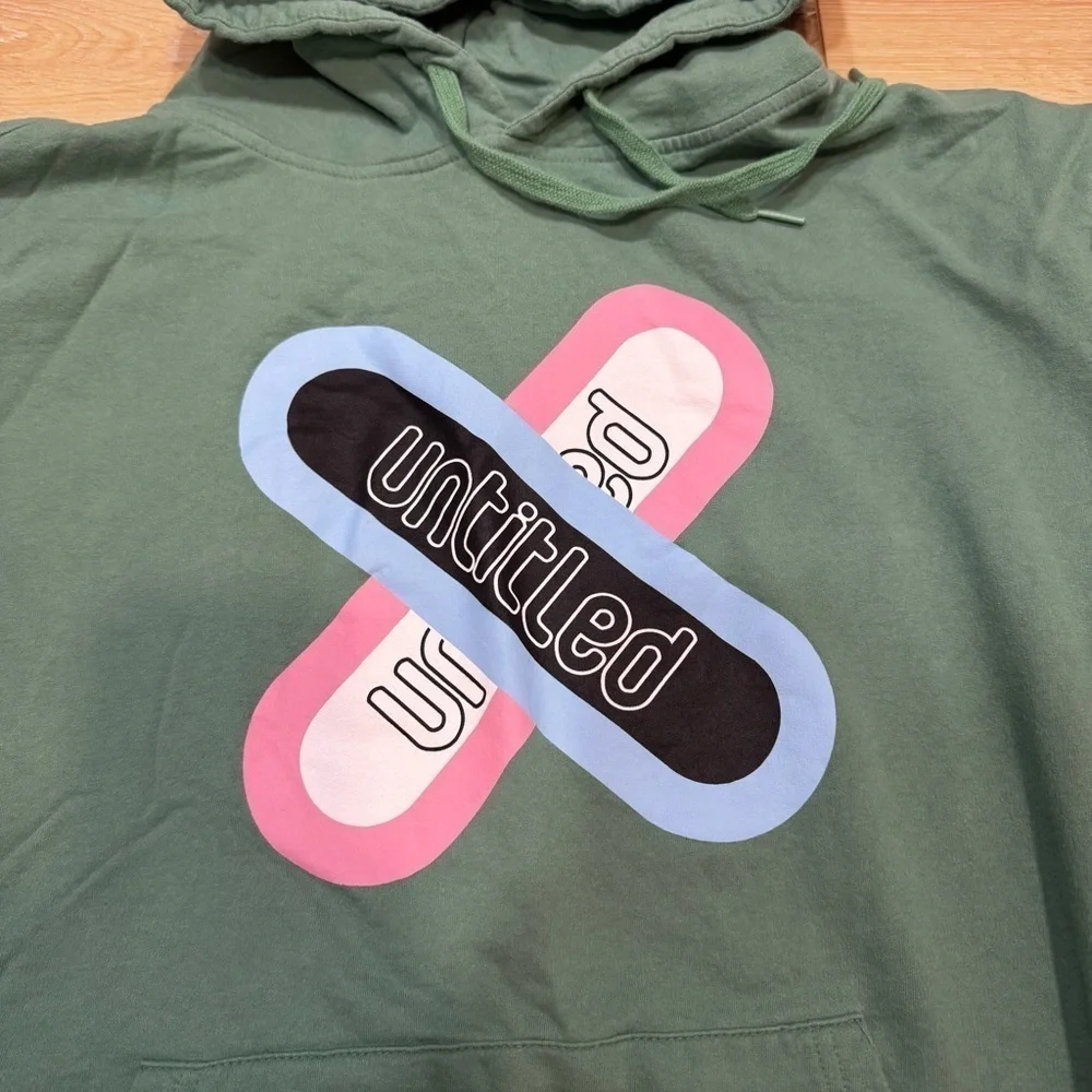 Designs Untitled green hoodie sweatshirt with blue & pink graphic spell out, L.